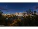 Nighttime view of the city skyline from this property with distant lights and crescent moon at 8432 S 21St Pl, Phoenix, AZ 85042