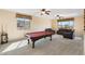 Game room with a pool table, comfortable seating and scenic views from large windows at 8432 S 21St Pl, Phoenix, AZ 85042