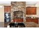 Close up of a gourmet kitchen featuring granite countertops and stone archway at 8432 S 21St Pl, Phoenix, AZ 85042