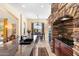 Gourmet kitchen featuring a stone archway and a view into the dining area at 8432 S 21St Pl, Phoenix, AZ 85042