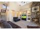 Spacious living room featuring a fireplace, high ceilings, and abundant natural light at 8432 S 21St Pl, Phoenix, AZ 85042