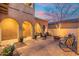 Charming patio area with an outdoor fire pit and seating, enhanced by decorative lights and a tranquil atmosphere at 8432 S 21St Pl, Phoenix, AZ 85042