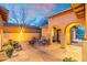 Inviting outdoor patio with stylish seating, cozy fire pit, and warm lighting, perfect for relaxing evenings at 8432 S 21St Pl, Phoenix, AZ 85042