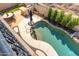 Overhead view of a backyard pool with a built-in barbecue area and desert landscaping at 8432 S 21St Pl, Phoenix, AZ 85042