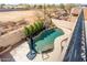 Aerial view of a backyard pool with desert landscaping, privacy walls, and a sunny sky at 8432 S 21St Pl, Phoenix, AZ 85042