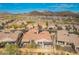 Lovely aerial view of neighborhood showing backyard outdoor living and mountain landscape at 9041 E Ivyglen Cir, Mesa, AZ 85207