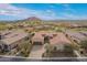 This is an aerial view of the house with a beautiful mountain view in the background at 9041 E Ivyglen Cir, Mesa, AZ 85207