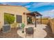 Backyard with patio, outdoor seating, fire pit, and built-in barbecue at 9041 E Ivyglen Cir, Mesa, AZ 85207