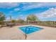 Inviting community hot tub with a clear sky and desert trees, perfect for relaxation at 9041 E Ivyglen Cir, Mesa, AZ 85207