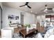 This is a bright living room features tile flooring, a ceiling fan, and stylish decor at 9041 E Ivyglen Cir, Mesa, AZ 85207