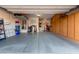 Spacious garage with ample storage cabinets and a clean, epoxy-coated floor at 9286 W Buckhorn Trl, Peoria, AZ 85383