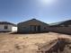 Exterior view of the house with a spacious backyard ready for landscaping and outdoor living at 9614 W Parkway Dr, Tolleson, AZ 85353