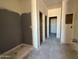 Bathroom area with a pre installed shower, and rough plumbing with walls ready for paint at 9614 W Parkway Dr, Tolleson, AZ 85353