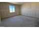 Spacious bedroom featuring a window providing natural light to the unfinished construction at 9614 W Parkway Dr, Tolleson, AZ 85353