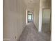 Hallway featuring white walls and a view to the exterior at 9614 W Parkway Dr, Tolleson, AZ 85353