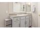 Bathroom has a vanity sink with a granite countertop and cabinet at 9857 E Fairview Ave, Mesa, AZ 85208