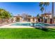 Inviting community pool featuring comfortable lounge chairs and shaded cabanas at 9857 E Fairview Ave, Mesa, AZ 85208