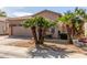 View of a tan home showcasing the desert landscaping featuring three beautiful palm trees in the front yard at 9857 E Fairview Ave, Mesa, AZ 85208