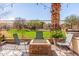 Outdoor patio area featuring seating and fire pit at 9857 E Fairview Ave, Mesa, AZ 85208