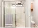 Bathroom features a tiled shower with sliding glass doors and a built-in seat at 9857 E Fairview Ave, Mesa, AZ 85208