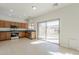 Well-lit kitchen featuring stainless steel appliances and a sliding glass door at 9939 W Southgate Ave, Tolleson, AZ 85353