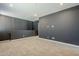 Upstairs bonus room featuring neutral carpet and gray walls at 10013 E Trent Ave, Mesa, AZ 85212