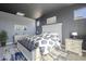 Stylishly decorated main bedroom with a white headboard, accent bench, and blue and white bedding at 10013 E Trent Ave, Mesa, AZ 85212