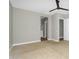 Neutral bedroom leads to en-suite with walk-in closet and bathroom featuring a vanity at 10144 E Thistle Ave, Mesa, AZ 85212