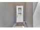 Welcoming front door with a glass pane and decorative wreath, set in a neutral-toned exterior at 10144 E Thistle Ave, Mesa, AZ 85212