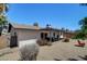 View of a backyard with a covered patio, landscaping, and fencing at 1015 E Concorda Dr, Tempe, AZ 85282