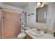 Bathroom features a pink-tiled shower, a white sink and toilet, and updated fixtures at 1015 E Concorda Dr, Tempe, AZ 85282