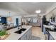 Open kitchen featuring sleek countertops, modern appliances, and a seamless flow into the living area at 1015 E Concorda Dr, Tempe, AZ 85282