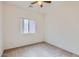 Bedroom with carpet flooring, a ceiling fan, and a window with natural light at 11725 W Jefferson St, Avondale, AZ 85323