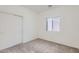 Bedroom with carpet flooring, natural light, and a closet for ample storage at 11725 W Jefferson St, Avondale, AZ 85323