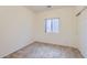 Neutral bedroom featuring a window, carpet flooring, and a closet for ample storage at 11725 W Jefferson St, Avondale, AZ 85323