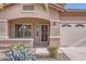 Welcoming front entrance with decorative security door and desert flora at 11725 W Jefferson St, Avondale, AZ 85323