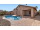 Inviting backyard pool with cool blue water and a surrounding patio area with desert landscaping at 11725 W Jefferson St, Avondale, AZ 85323