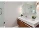 Modern bathroom featuring a floating vanity, stylish mirror and decorative mosaic backsplash at 146 E Coronado Rd # 39, Phoenix, AZ 85004