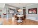 Cozy dining area featuring a white round table, brown chairs, and modern lighting at 126 E Coronado Rd # 39, Phoenix, AZ 85004