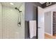 Clean shower with white subway tile, a bronze shower head and a small bench at 126 E Coronado Rd # 39, Phoenix, AZ 85004