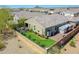 Aerial view of the backyard featuring a well-maintained lawn and a charming pergola-covered patio at 13451 W Remuda Dr, Peoria, AZ 85383