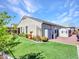 Backyard of a one story home with a shed, manicured landscaping and an expansive artificial lawn at 13451 W Remuda Dr, Peoria, AZ 85383