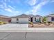 Beautiful single-story home with a spacious three-car garage and charming curb appeal at 13451 W Remuda Dr, Peoria, AZ 85383