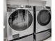 Modern laundry room with a Samsung front load washer and dryer at 13451 W Remuda Dr, Peoria, AZ 85383