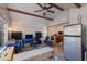 Spacious studio featuring exposed beams, ceiling fan, and eclectic decor at 1822 N Laurel Ave, Phoenix, AZ 85007