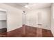 Spacious bedroom with a walk-in closet, ceiling fan, and neutral color palette at 1859 E Gemini Dr, Tempe, AZ 85283