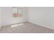 Empty bedroom with carpet, window and base molding at 20261 W Monterey Way, Buckeye, AZ 85396