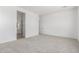 Large bedroom featuring plush carpeting and an ensuite bathroom, with bright neutral paint at 20261 W Monterey Way, Buckeye, AZ 85396