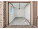 A smaller two-car garage with concrete flooring, drywall and a window for natural light at 20261 W Monterey Way, Buckeye, AZ 85396