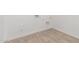 This laundry room has tile floors and white walls with hookups for a washer and dryer at 20261 W Monterey Way, Buckeye, AZ 85396